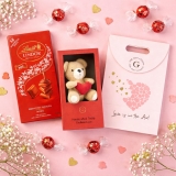 THE GIFT STUDIO.COM Valentine Gifts for Girlfriend, Valentine Gifts for Boyfriend, Valentine Gifts for Wife, Valentine Gifts for Husband, Valentine Gifts for Couples, Romantic Gifts for Valentine Day, | Sweet Love & Cuddles Hamper | Love Is In The Air Gift Bag with Lindt Lindor Milk Chocolate (100g) & Soft Teddy |Valentine gift for Girlfriend and Boyfriend